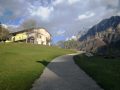 Patocco casa jeris con luce di tramonto e Monte Sart nel Val Raccolana